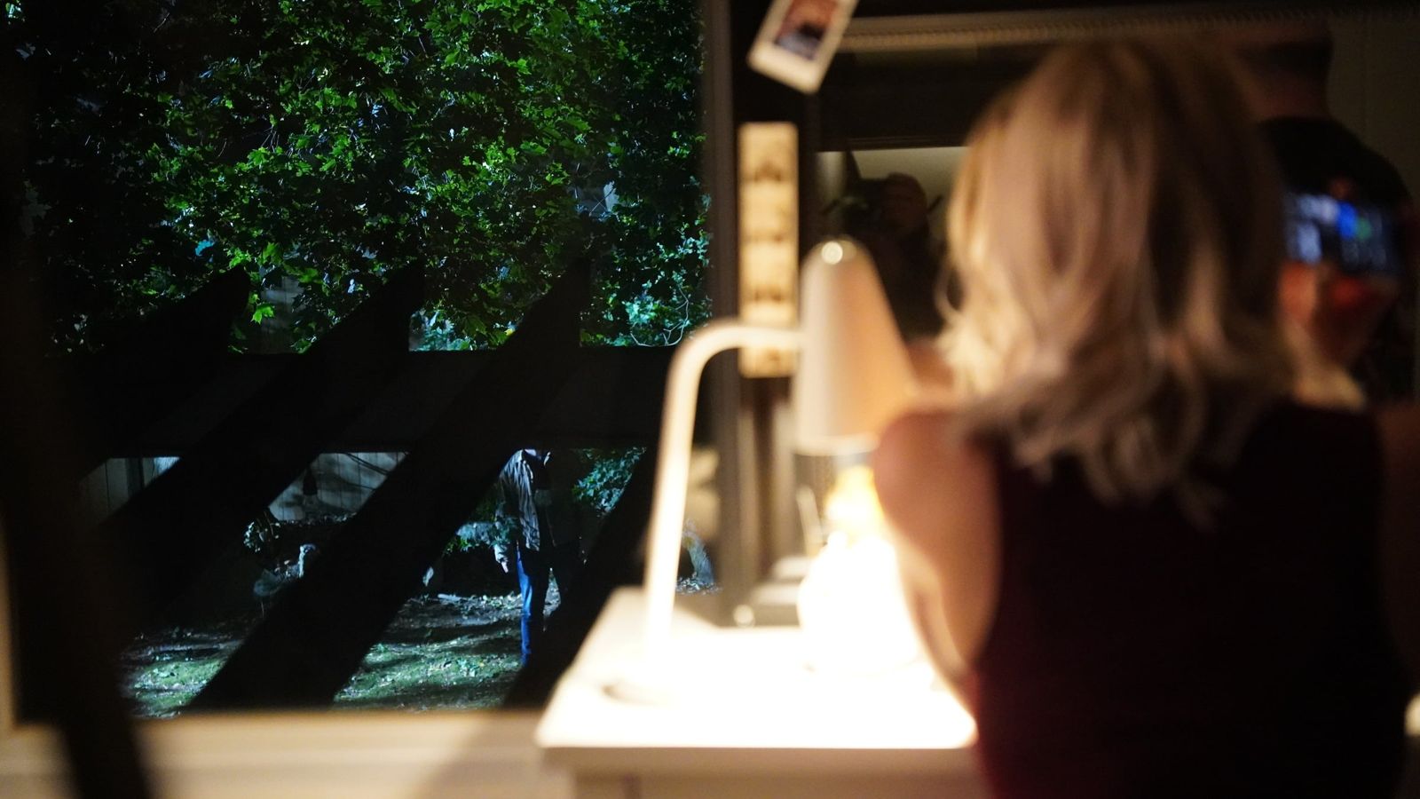 Crew member at the monitor at night