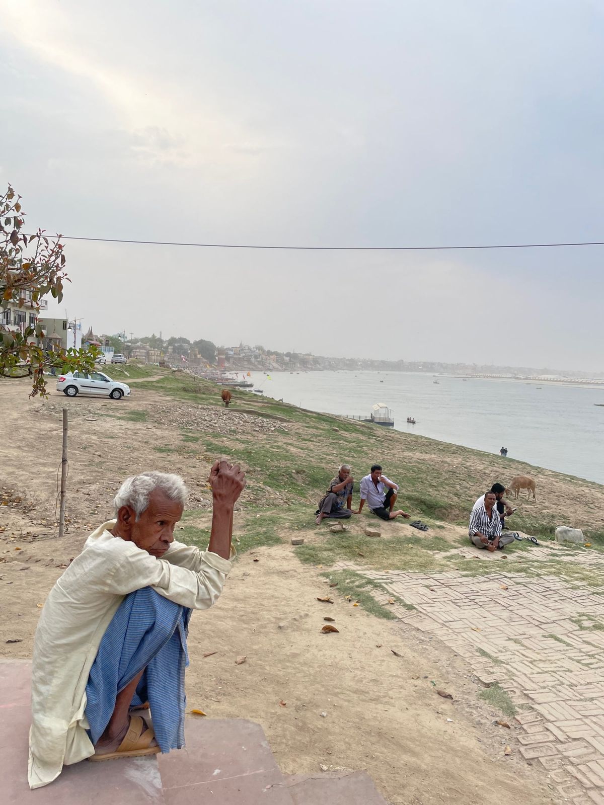 Elderly man on the riverbank