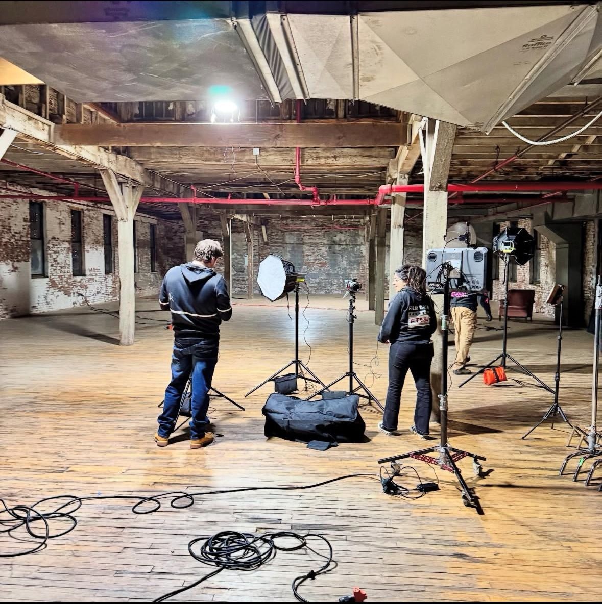 Warehouse set with lights on stands and cable runs